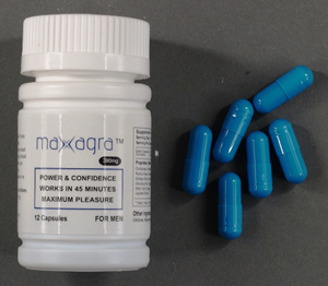 Maxagra bottle and capsules